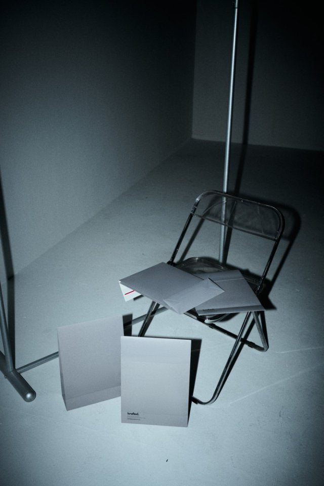 Flat, unassembled kraft mailer box